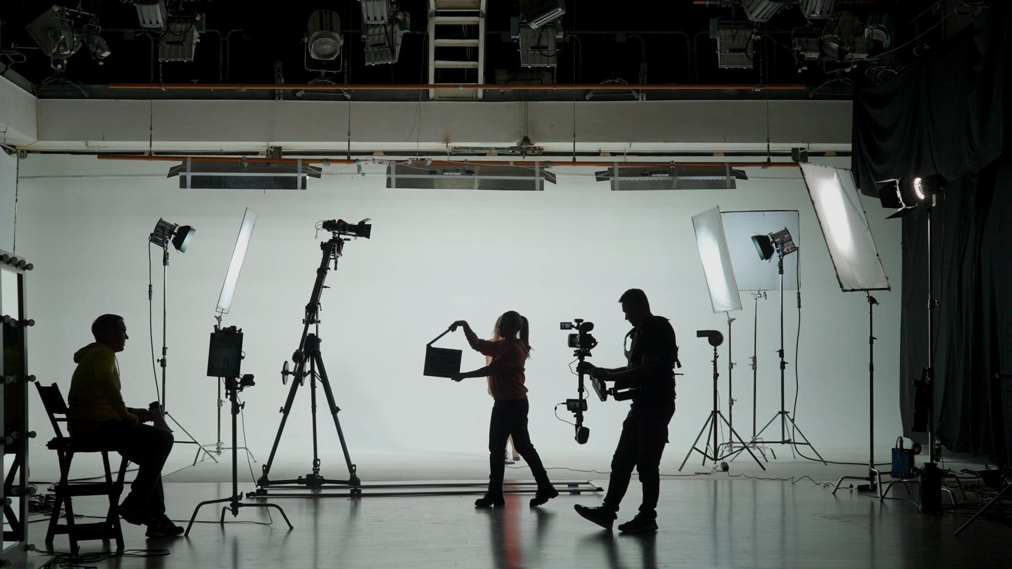 Music Clip Studio Set: Shooting Hip Hop Video Dance Scene with Three Professionals Dancers Performing on Stage with Big Led Screen with Modern City Background. Director and Cameraman in Backstage. SSUCv3H4sIAAAAAAAACoxTPY/bMAzdC/Q/BJ5PqGR92Lrxhm4Fuhc3UBJ1EeLYgS2nOBzuv5e240QdCtST+B71SD2TH1+/HA6Vgyn56vnwsUQUp66bpzxCTkNPMH+64SP2AccSuY7S8BKAVEYYUh7GBF0JOsj+2MMZCeznrlvgz5Wspgx5nnBaerlBHjK+kcYG3iW2hn9t8WEnVpJuEFX9xOHSYfVUMNPsFuZHmjx2HfQ4zFO181u9f4i9IMz5/dt3mI6LJ/8vuh1e7/a8Ye/fHy9ZKoxIRl/xDOMJc/koIsVd6XU7rII3a0bsEDa3bneq2rccpOesjW3NVBNa5kKjmKmt0sq3wWOzd1/VKF2I2jNoMDJllGYQAFlsVNOCF76x7SM5ahWDBWL9oqxq1vLaMBSxlY3mQihxT+beUmwti1IZpoThpBwjC+iwdq5ukcdHsjOccGAIijPV6sCIt8xSjWCcjk7Ie7J0mj7hmdZ1w5SjEwhL3YuoSNaAtHH1bLO8Ov3OOJ7LgYI5pKGYpevgoVsSZGEtpAuM8Ne9y5h86t8KZMjHdRt2JT/MfR6Xv1vd++2G4QKO5vD5EKkM7vgRponSw44XtT3t3nAu6vRDXn/yTbUKtBJLKKRUqml0U2thrDDS3BK2NTom0lnb2YUo9qcUylelpYNqGQwvjGY+WHLVIo0N58iC4hICRivaQK5+/gEAAP//AwD0JQrVLwQAAA==